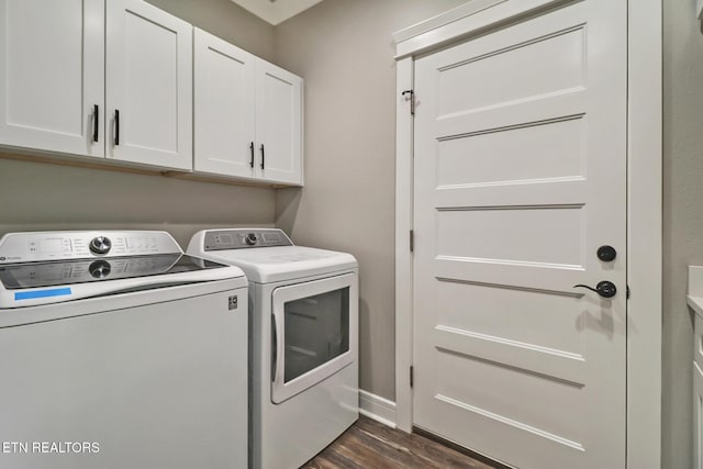 laundry room with washer and dryer, cabinet space, dark wood-type flooring, and baseboards