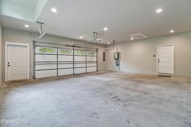 garage featuring recessed lighting and a garage door opener