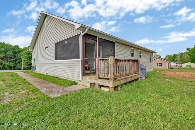 838 Buffalo Trl, Clarkrange, TN 38553 - back of property with a lawn, a wooden deck, and a sunroom