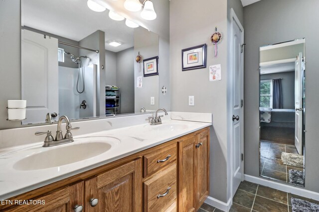 838 Buffalo Trl, Clarkrange, TN 38553 - bathroom with baseboards, double vanity, a shower, and ensuite bath