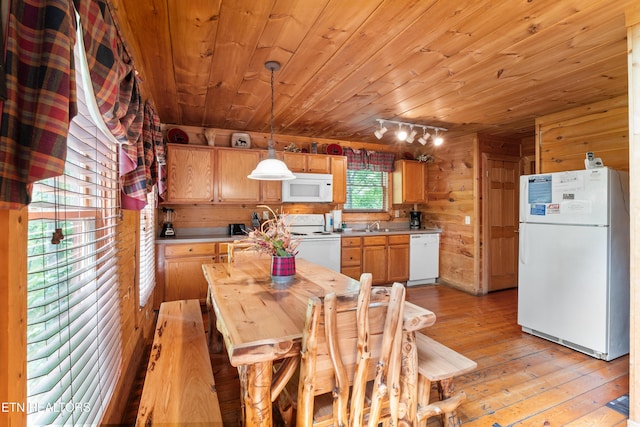 kitchen featuring white appliances, wooden ceiling, light countertops, light wood-style floors, and wooden walls