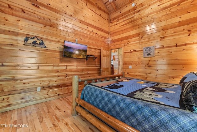 bedroom with wood walls, hardwood / wood-style flooring, and wood ceiling