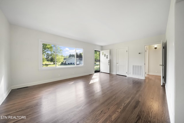 908 Glenoaks Dr, Knoxville, TN 37918 - unfurnished living room with dark wood-style floors and baseboards