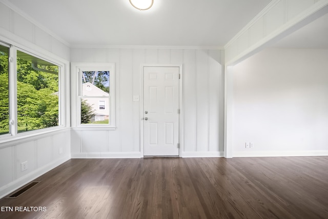 908 Glenoaks Dr, Knoxville, TN 37918 - foyer with crown molding, dark wood-style floors, and a decorative wall