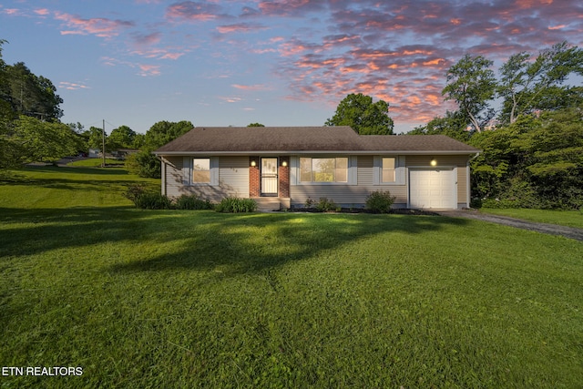 908 Glenoaks Dr, Knoxville, TN 37918 - view of front facade with an attached garage, driveway, and a yard
