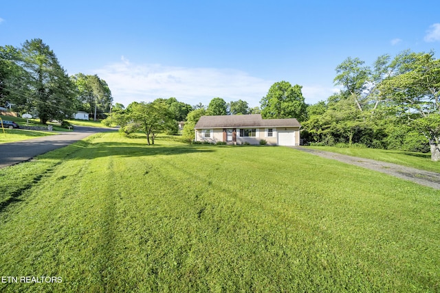 908 Glenoaks Dr, Knoxville, TN 37918 - view of front of house with driveway, a garage, and a front lawn