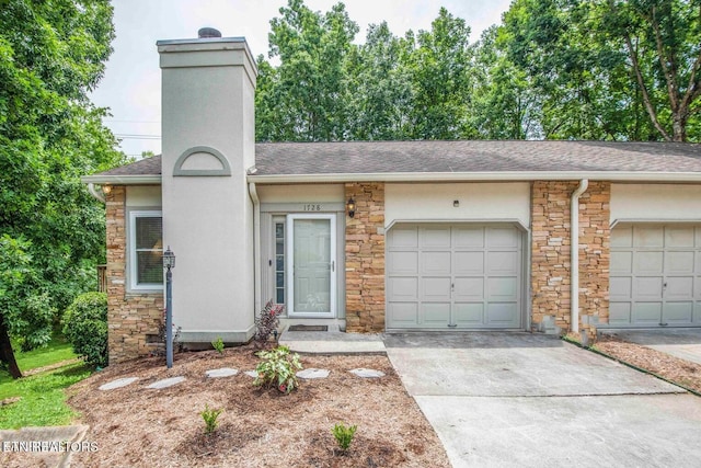 ranch-style house featuring stone siding, a chimney, and concrete driveway