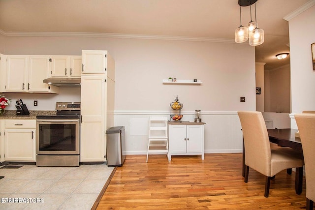 kitchen with electric stove, under cabinet range hood, ornamental molding, white cabinets, and light wood-style floors