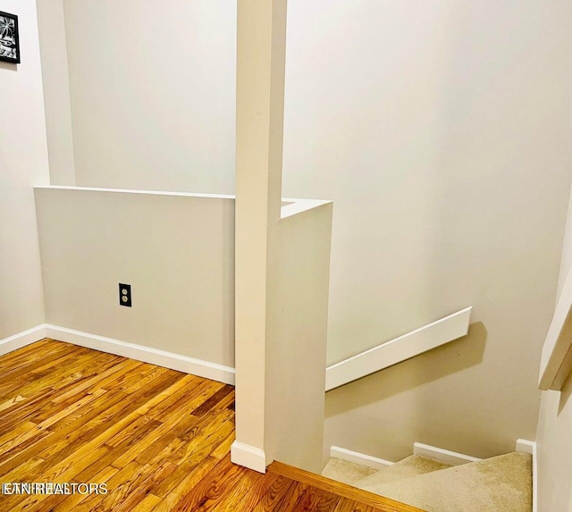 basement with wood finished floors and baseboards