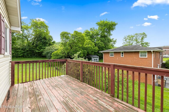3606 Sevier Heights Rd, Knoxville, TN 37920 - wooden terrace with a storage shed, a yard, and an outbuilding