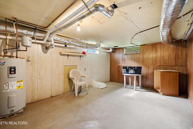 3606 Sevier Heights Rd, Knoxville, TN 37920 - basement featuring water heater and wood walls