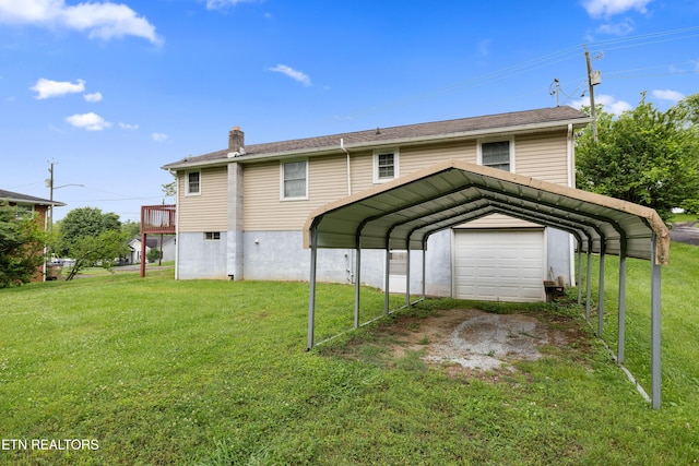 3606 Sevier Heights Rd, Knoxville, TN 37920 - rear view of property with a lawn, driveway, a chimney, a garage, and a detached carport
