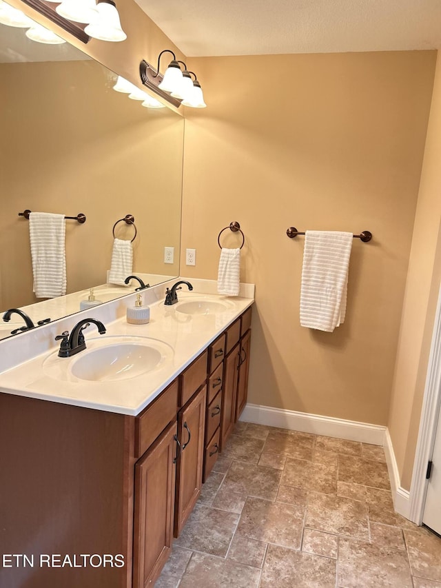 326 Joshua Landing Ct, Seymour, TN 37865 - full bath with double vanity, baseboards, and stone finish floors