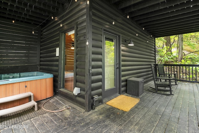deck with a hot tub