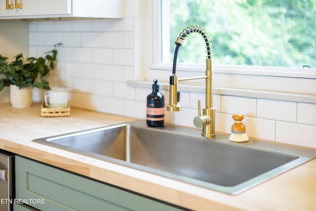 3219 Sunset Ave, Knoxville, TN 37914 - kitchen view of a sink, butcher block countertops, and backsplash