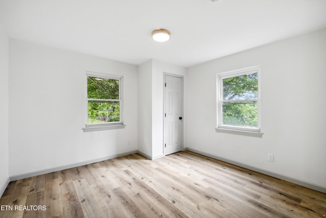 3219 Sunset Ave, Knoxville, TN 37914 - spare room featuring plenty of natural light, wood finished floors, and baseboards
