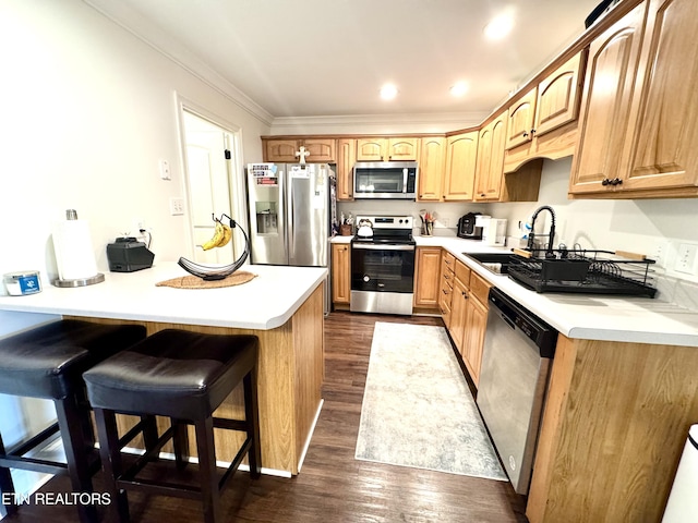 208 Cornerstone Cir, Clinton, TN 37716 - kitchen with stainless steel appliances, crown molding, dark wood finished floors, light countertops, and a breakfast bar area