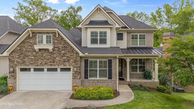 462 Chapel Grove Ln, Knoxville, TN 37934 - craftsman inspired home featuring a porch, driveway, roof with shingles, a garage, and a front lawn