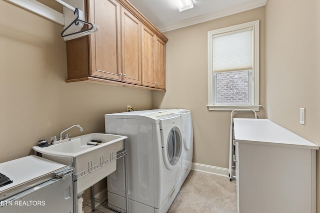 462 Chapel Grove Ln, Knoxville, TN 37934 - laundry area with cabinet space, independent washer and dryer, ornamental molding, and light tile patterned floors