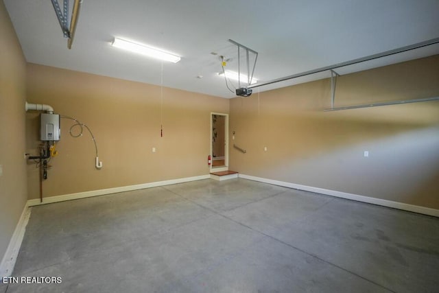 462 Chapel Grove Ln, Knoxville, TN 37934 - garage featuring tankless water heater and a garage door opener