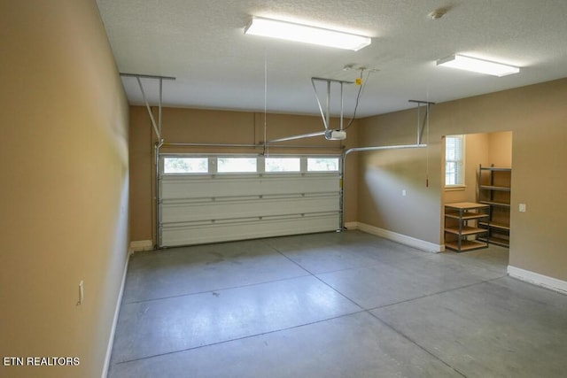462 Chapel Grove Ln, Knoxville, TN 37934 - garage featuring a garage door opener and baseboards