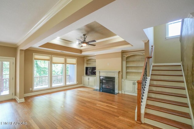 462 Chapel Grove Ln, Knoxville, TN 37934 - unfurnished living room featuring crown molding, a ceiling fan, a fireplace, a raised ceiling, and stairway