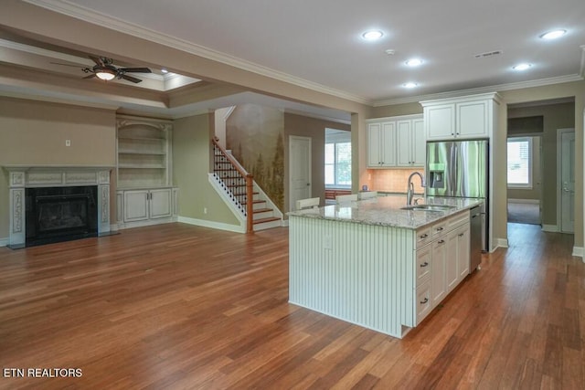 462 Chapel Grove Ln, Knoxville, TN 37934 - kitchen featuring healthy amount of natural light, wood finished floors, white cabinets, ornamental molding, and recessed lighting