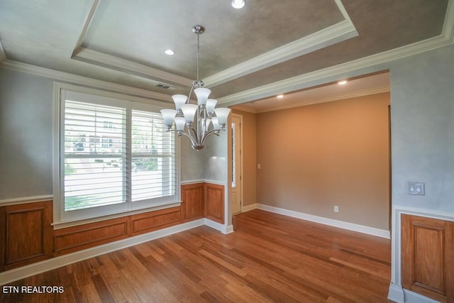 462 Chapel Grove Ln, Knoxville, TN 37934 - unfurnished dining area with a raised ceiling, a chandelier, wood finished floors, ornamental molding, and a wainscoted wall