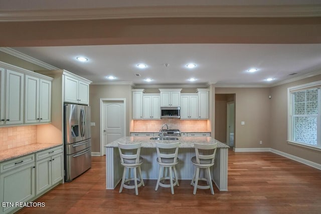 462 Chapel Grove Ln, Knoxville, TN 37934 - kitchen featuring stainless steel appliances, tasteful backsplash, dark wood-style flooring, light stone counters, and recessed lighting