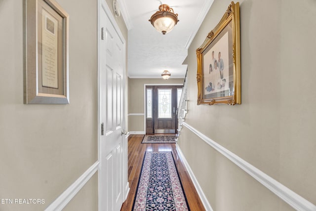 1182 Murrell Rd, Morristown, TN 37814 - doorway featuring crown molding, dark wood-style floors, and baseboards