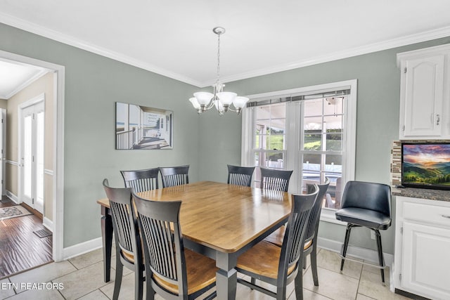 1182 Murrell Rd, Morristown, TN 37814 - dining space with ornamental molding, light tile patterned flooring, baseboards, and a chandelier
