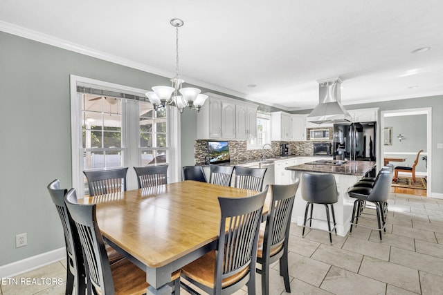 1182 Murrell Rd, Morristown, TN 37814 - dining space with crown molding, baseboards, and a chandelier