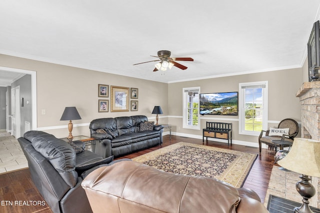 1182 Murrell Rd, Morristown, TN 37814 - living room with a ceiling fan, dark wood finished floors, baseboards, crown molding, and a fireplace