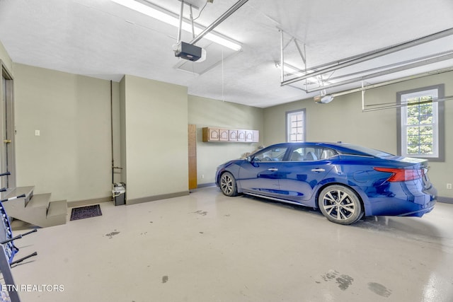 1182 Murrell Rd, Morristown, TN 37814 - garage with a garage door opener and baseboards