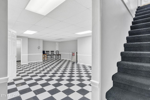 1182 Murrell Rd, Morristown, TN 37814 - basement with tile patterned floors, stairs, baseboards, and a drop ceiling