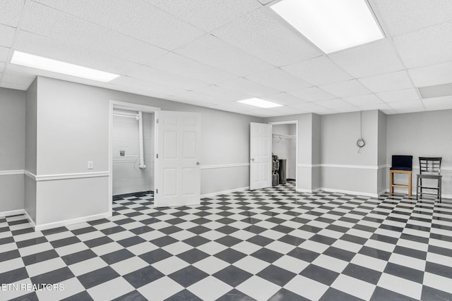 1182 Murrell Rd, Morristown, TN 37814 - below grade area featuring a drop ceiling, tile patterned floors, and baseboards