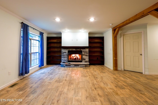 915 Yellow Breeches Rd, Cosby, TN 37722 - unfurnished living room featuring crown molding, a stone fireplace, baseboards, wood finished floors, and recessed lighting