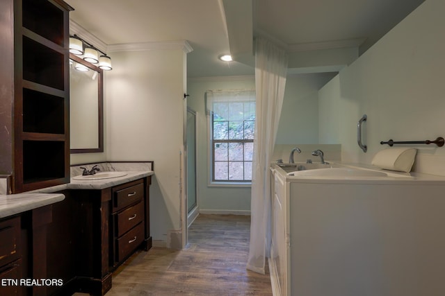915 Yellow Breeches Rd, Cosby, TN 37722 - full bathroom with crown molding, two vanities, wood finished floors, a stall shower, and recessed lighting