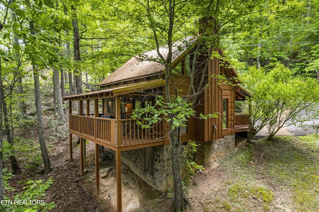 view of outdoor structure with a view of trees