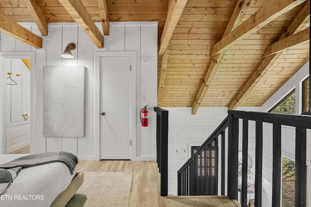 bedroom with wooden ceiling and wood finished floors