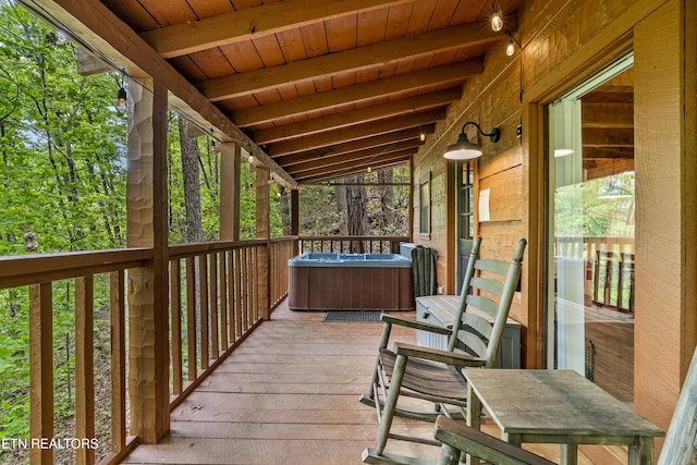 deck with a hot tub