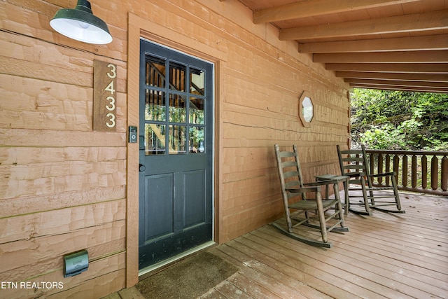 property entrance with covered porch