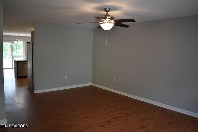 33 Wood Ln, Sparta, TN 38583 - unfurnished room featuring a ceiling fan, dark wood-style flooring, a chandelier, and baseboards