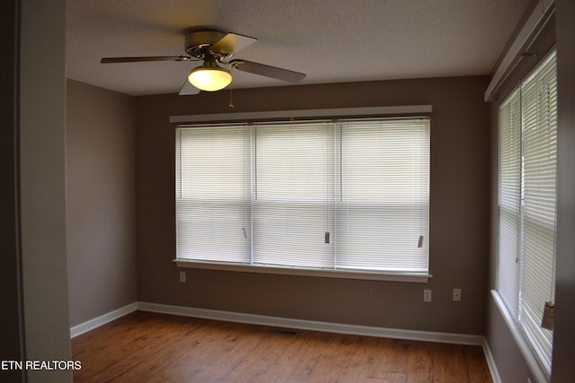 33 Wood Ln, Sparta, TN 38583 - spare room featuring baseboards, ceiling fan, and wood finished floors