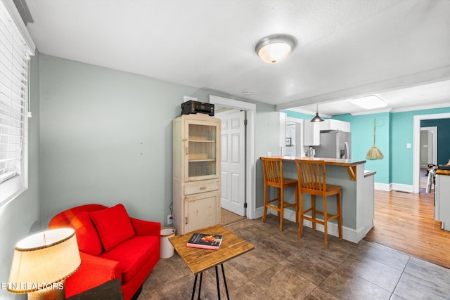 1735 NE Albert Ave, Knoxville, TN 37917 - living room featuring baseboards and tile patterned floors