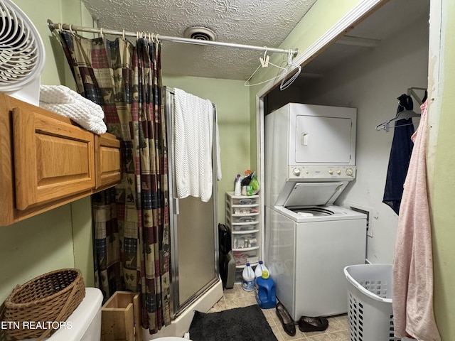 1040 Sturmhaben Way, Newport, TN 37821 - washroom featuring stacked washing machine and dryer, a textured ceiling, and light tile patterned floors