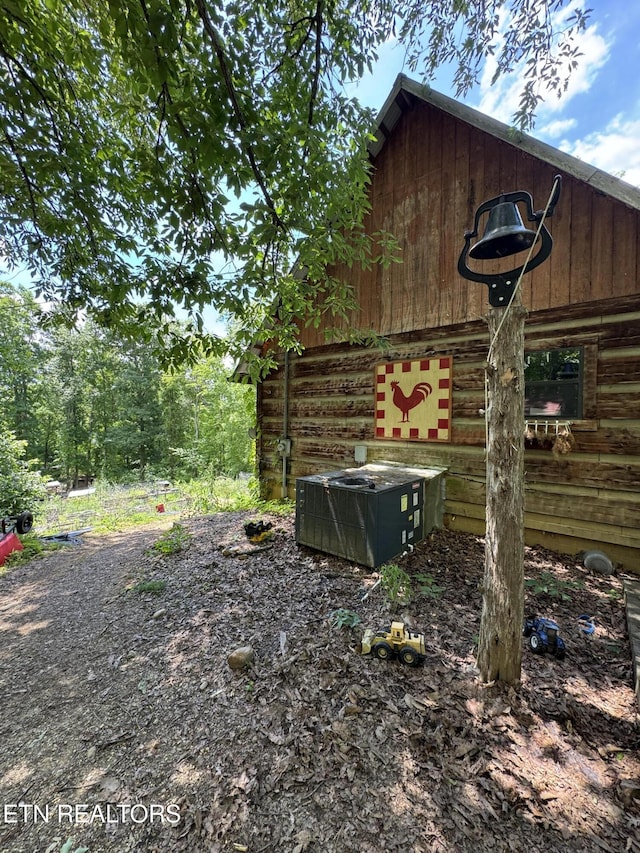 1040 Sturmhaben Way, Newport, TN 37821 - view of side of property with central AC unit and log exterior