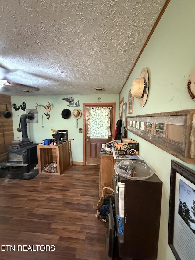 1040 Sturmhaben Way, Newport, TN 37821 - misc room with a wood stove, a textured ceiling, and wood finished floors