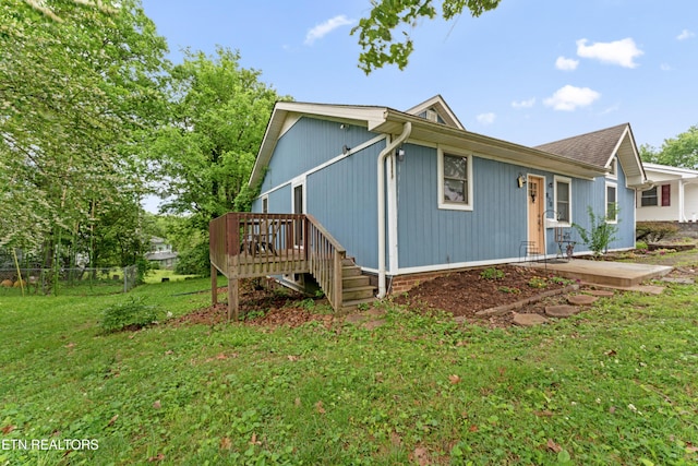 view of side of home featuring a deck