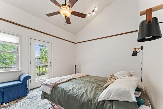 bedroom featuring vaulted ceiling, access to exterior, and ceiling fan